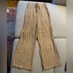 Tan pants with elastic band.